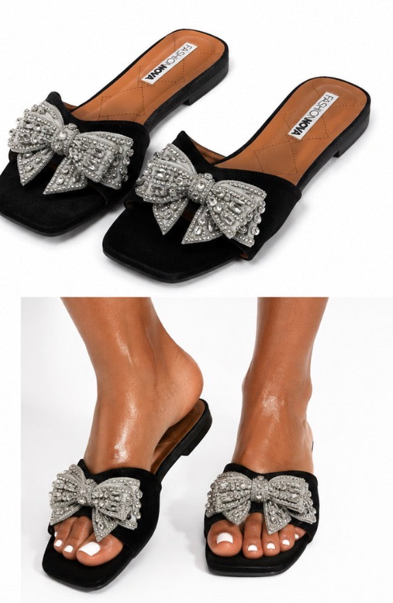 Fashion Nova women’s black and silver slide/mule sandals, size 11, with a large silver rhinestone bow
