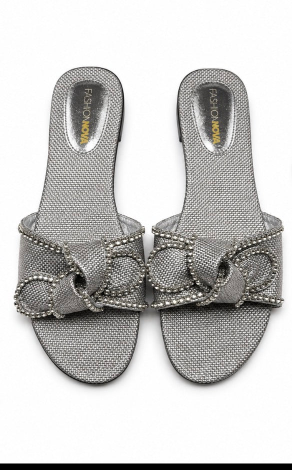 Fashion Nova women’s silver slide/mule sandals, size 11, with a large silver rhinestone bow