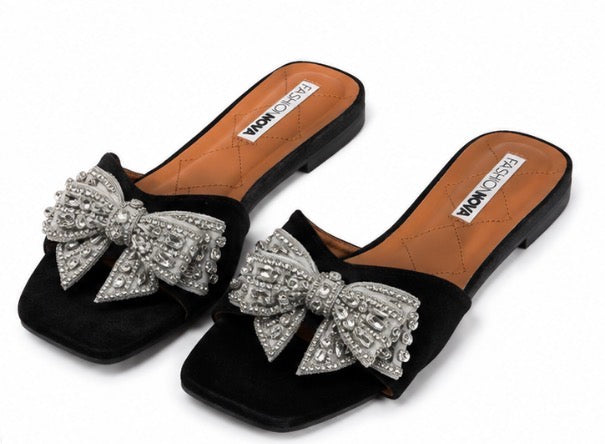 Fashion Nova women’s black and silver slide/mule sandals, size 11, with a large silver rhinestone bow