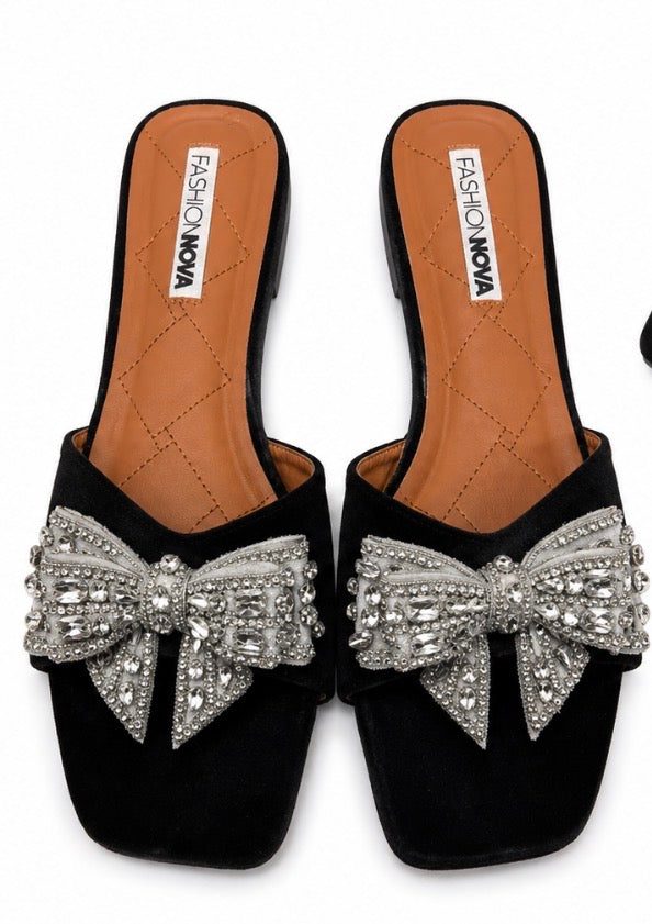Fashion Nova women’s black and silver slide/mule sandals, size 11, with a large silver rhinestone bow