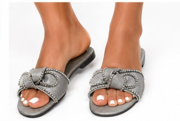 Fashion Nova women’s silver slide/mule sandals, size 11, with a large silver rhinestone bow