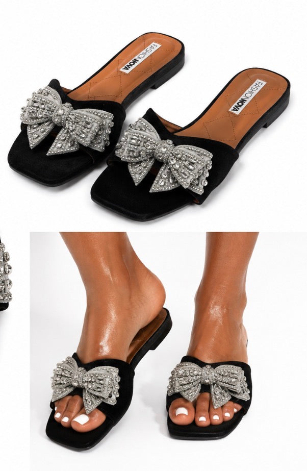 Fashion Nova women’s black and silver slide/mule sandals, size 11, with a large silver rhinestone bow